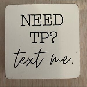 Bathroom sign. Text me sign.